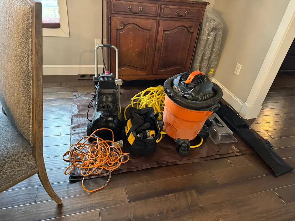 Nikro negative-pressure duct cleaning machine set up at a residential job