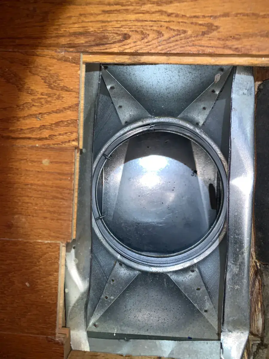 Interior of a main trunk duct after source-removal cleaning, showing clean bare metal