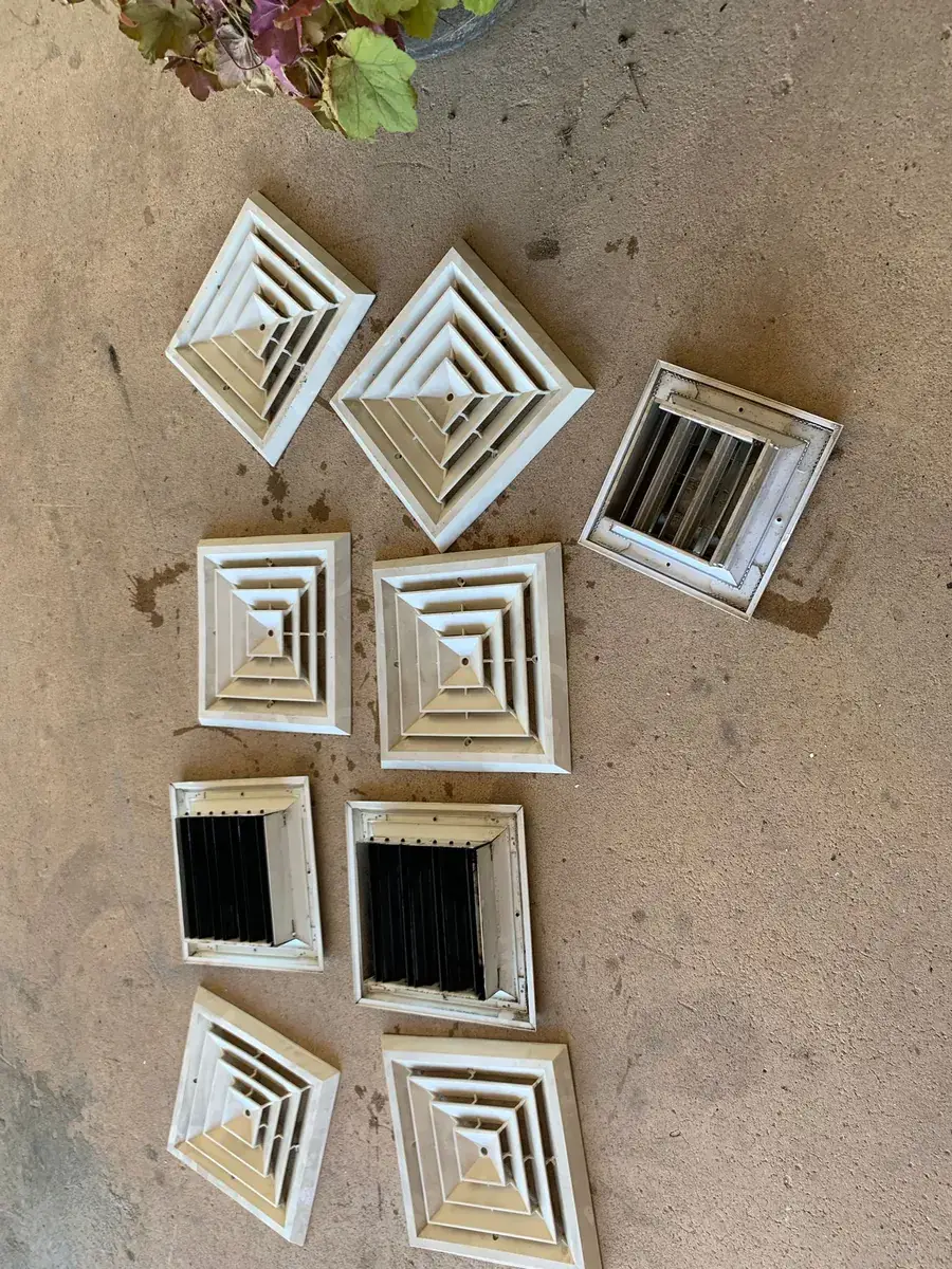 Supply vent covers removed and gathered for washing during an air duct cleaning